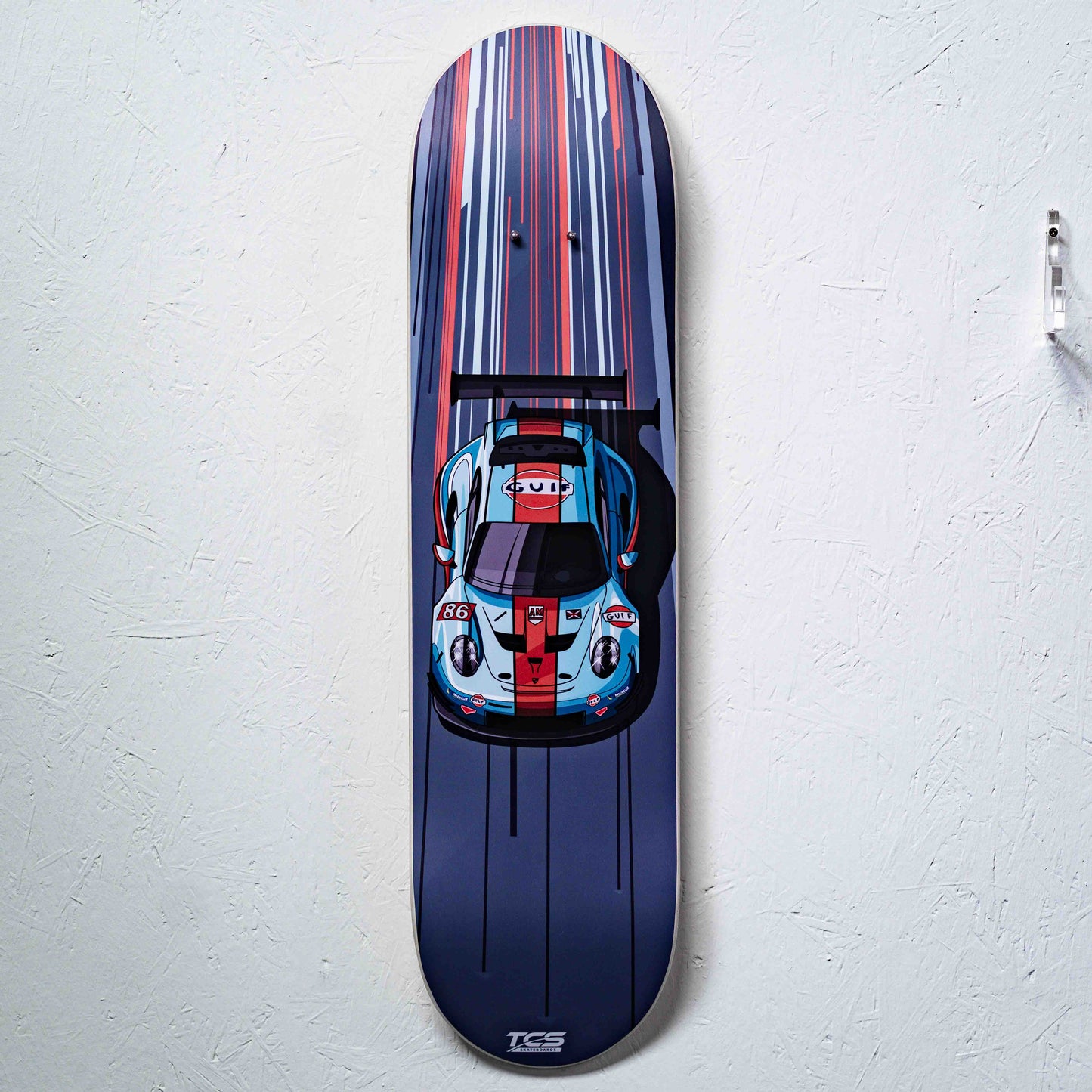 Skateboard deck with a car design on a white background