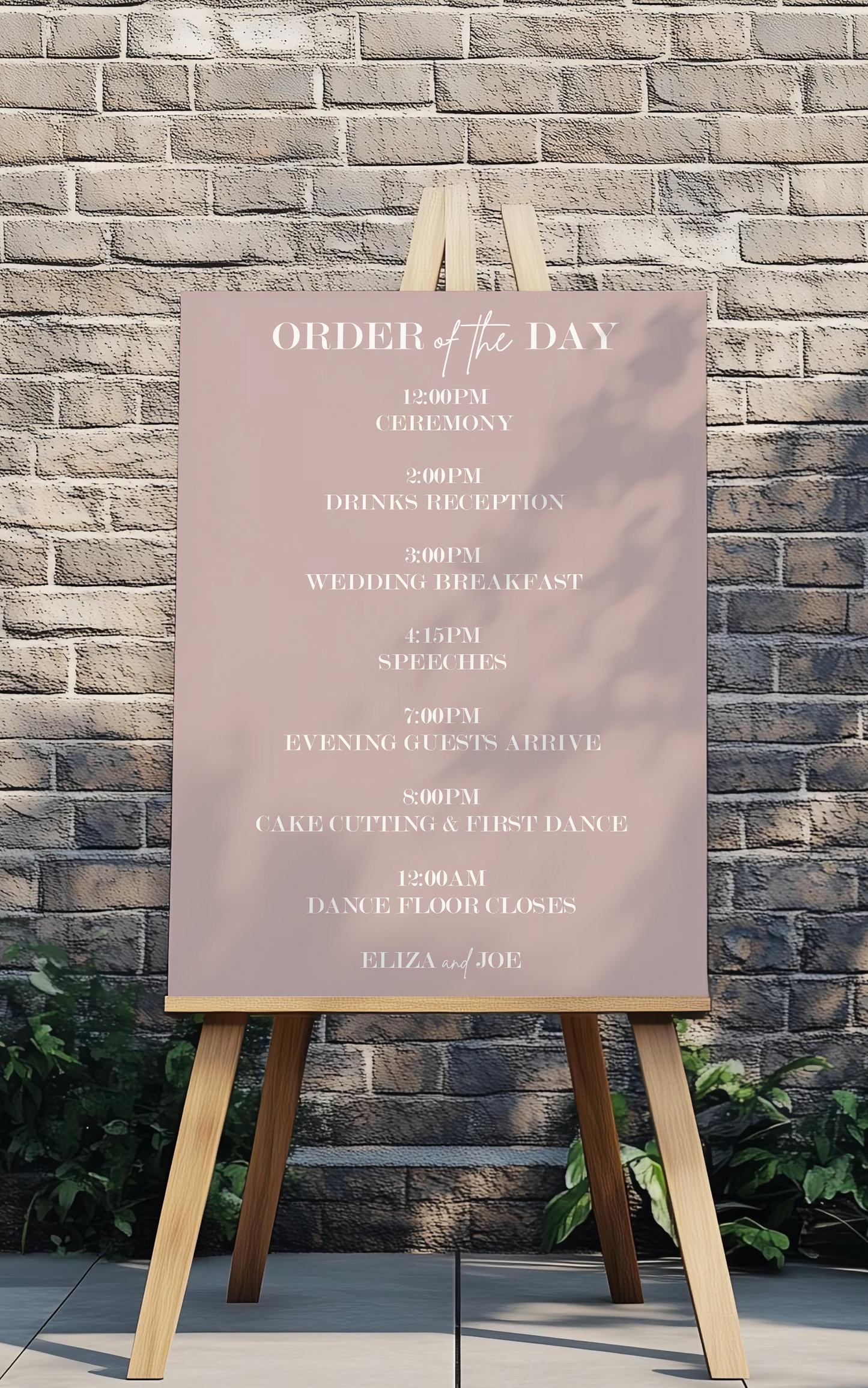 Order of the Day sign on an easel against a stone wall
