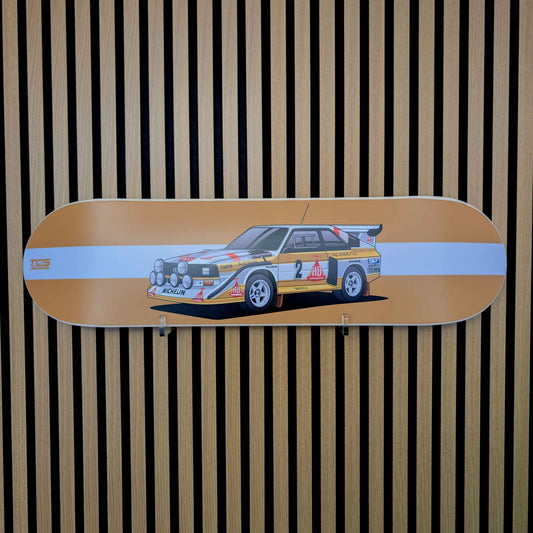 Skateboard deck with a car design on a striped background
