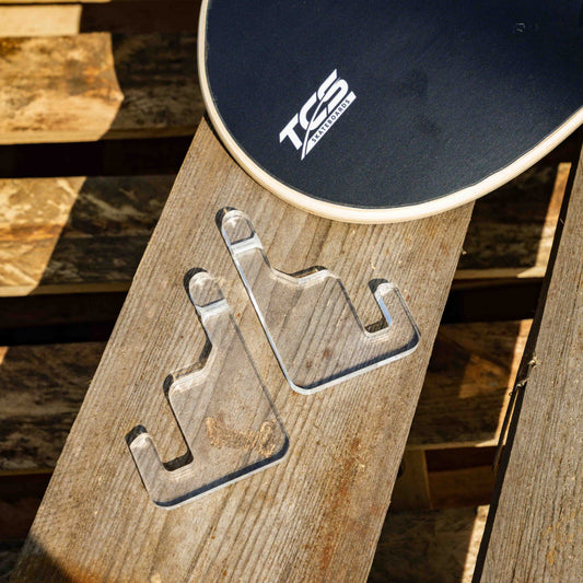 Acrylic wall hangers on a wooden bench