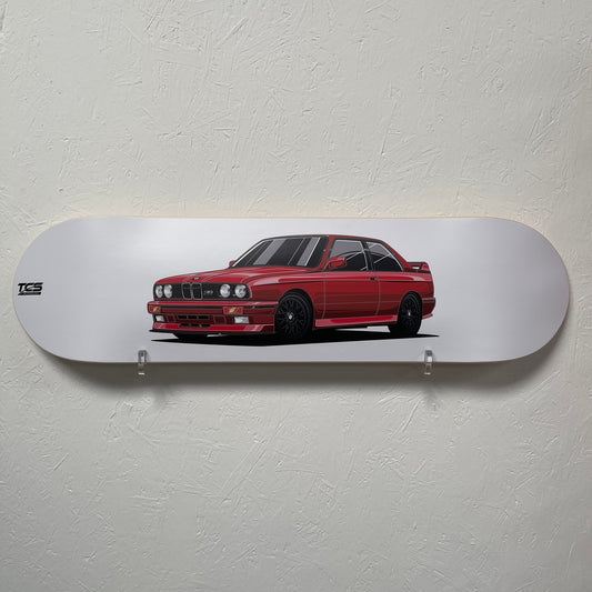 Skateboard deck with a red car design on a white background