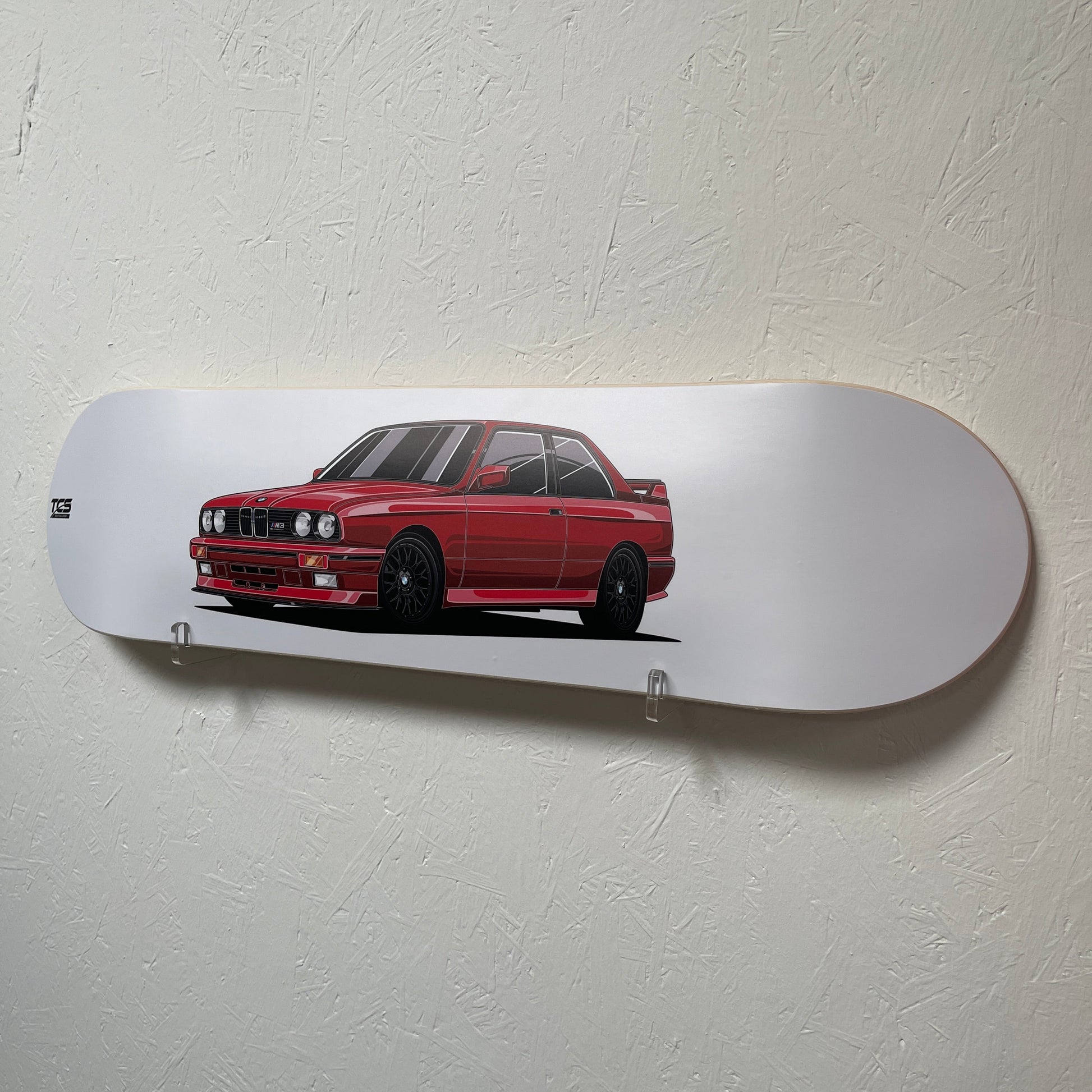 Skateboard deck with a red car design on a white background