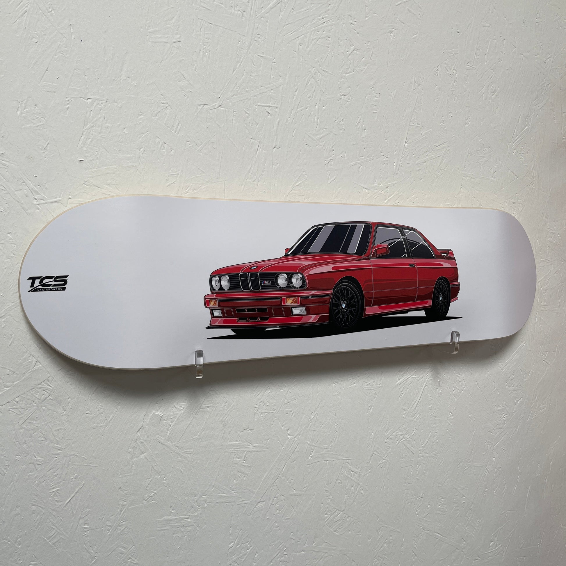 Skateboard deck with a red car design on a white background