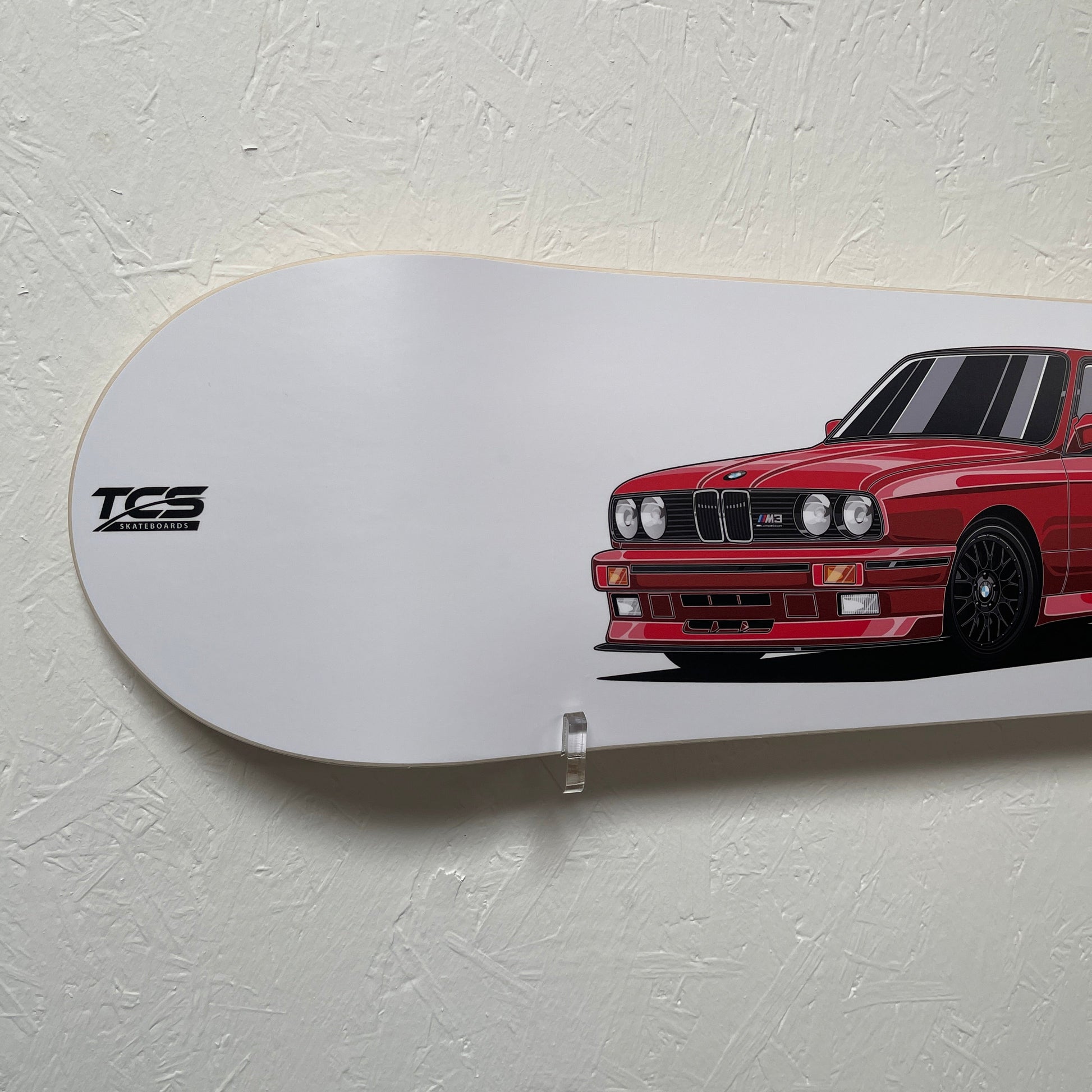 Skateboard with a red car design on a white background