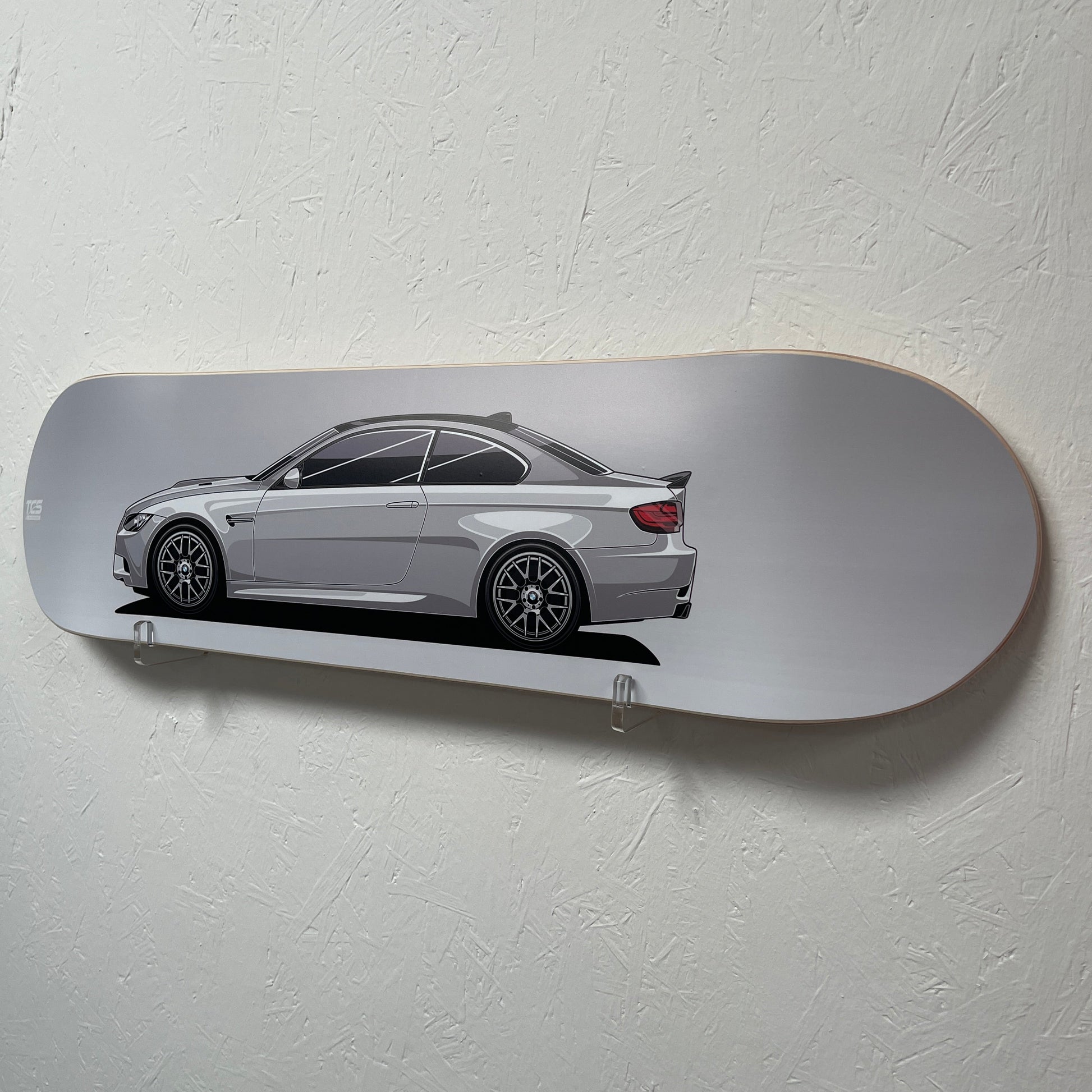 Skateboard with a car design on a white wall