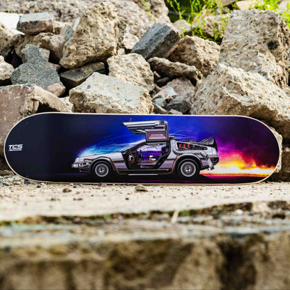 Skateboard with a futuristic vehicle design on a rocky surface
