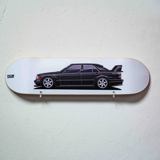 Skateboard deck with a black car design on a white background