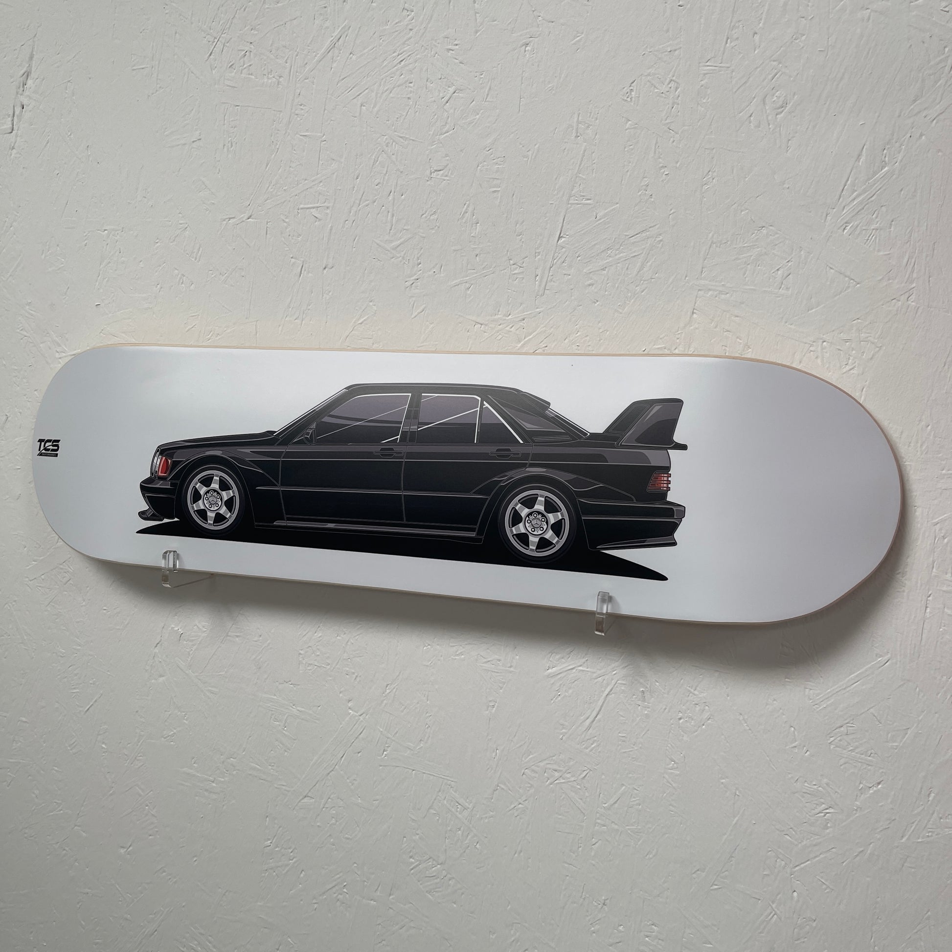 Skateboard deck with a car design on a white background