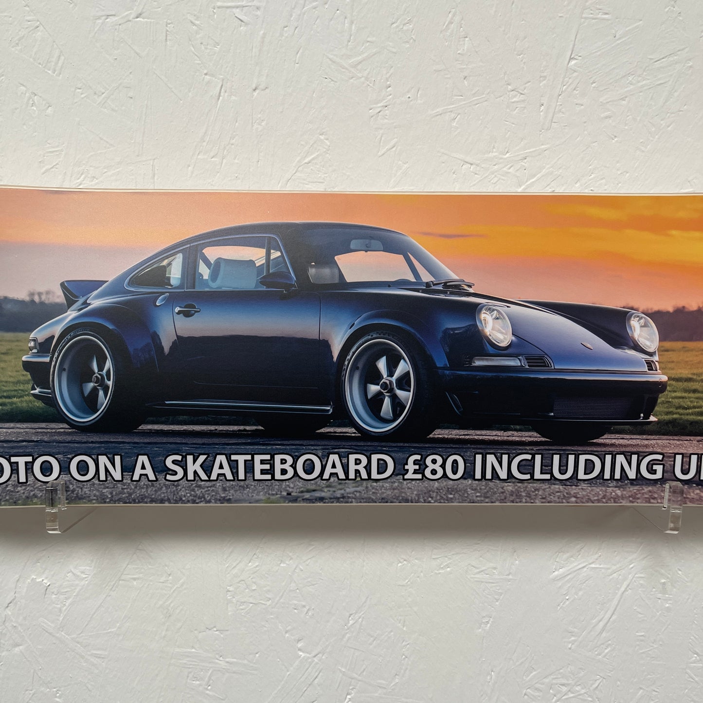 Blue sports car on a skateboard with text overlay