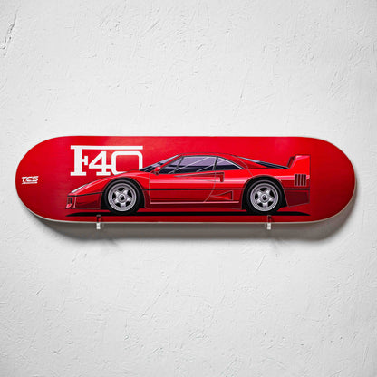 Red skateboard deck with a car design and 'F40' branding on a white background