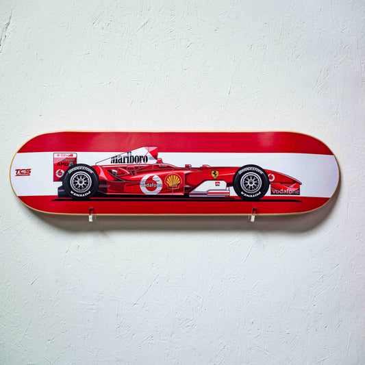 Skateboard deck with a red and white Formula 1 car design on a light gray background