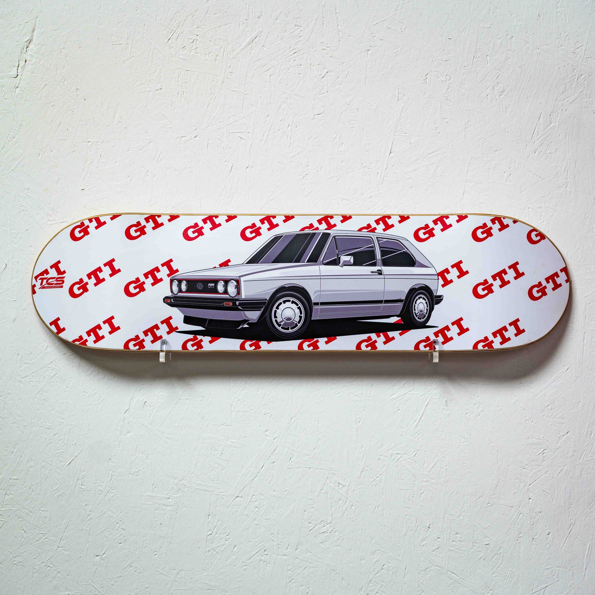 Skateboard deck with a car illustration and 'GTI' branding on a white background