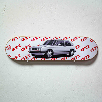 Skateboard deck with a car illustration and 'GTI' branding on a white background