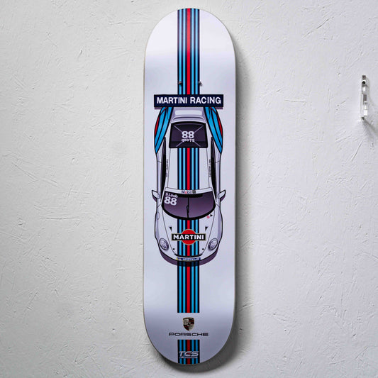 Skateboard deck with Martini Racing Porsche design on a white background