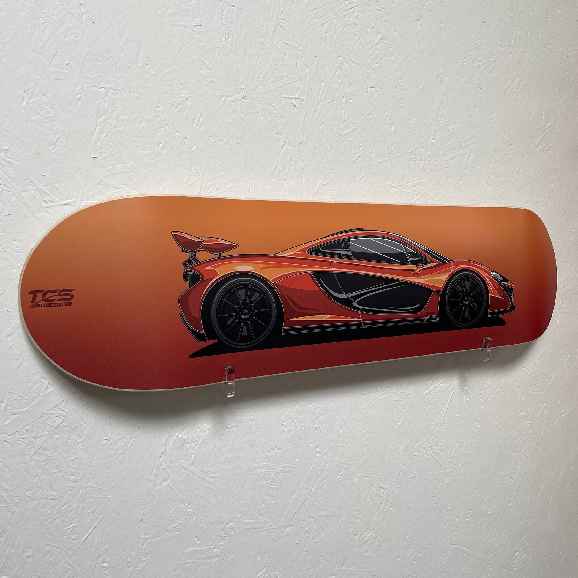 Skateboard deck with car design on a white background