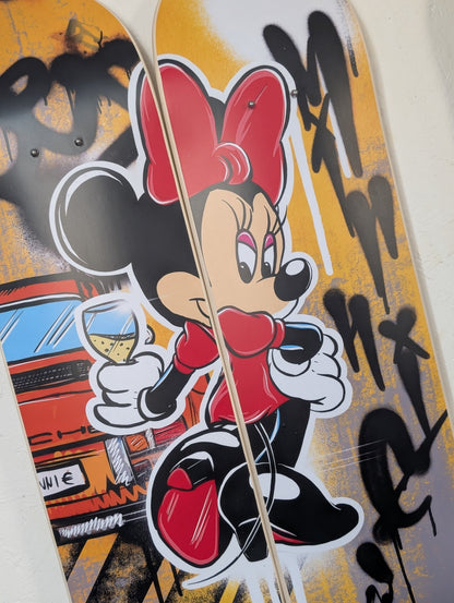 Skateboard deck with Minnie Mouse design and colorful graphics