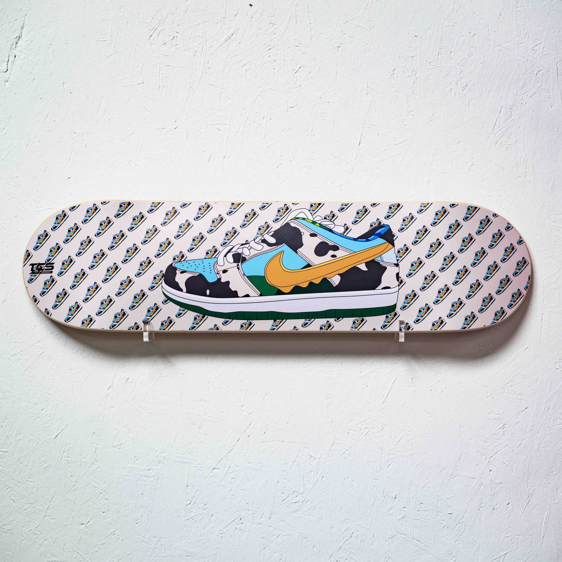 Skateboard deck with a cow design and Nike logo on a white background