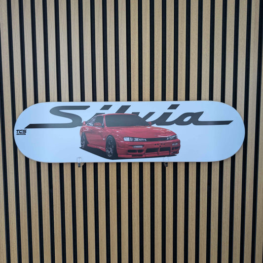 Sticker of a red Nissan Silvia S14 car with 'Silvia' text on a striped background