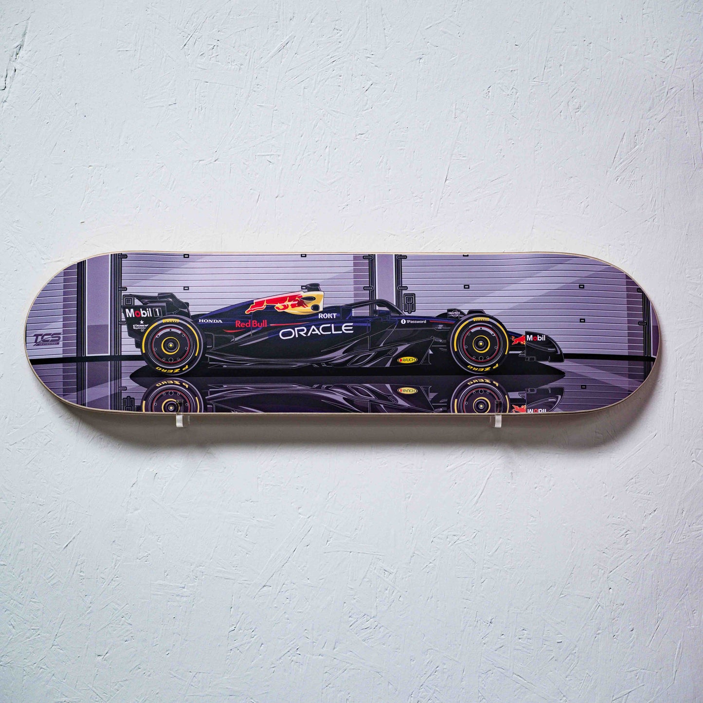 Skateboard deck with Formula 1 car design on a white background
