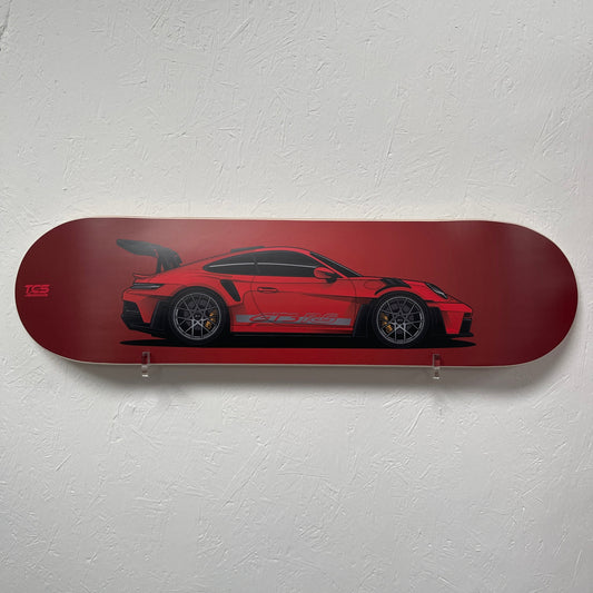 Red GT3RS skateboard deck with a red car design on a white wall