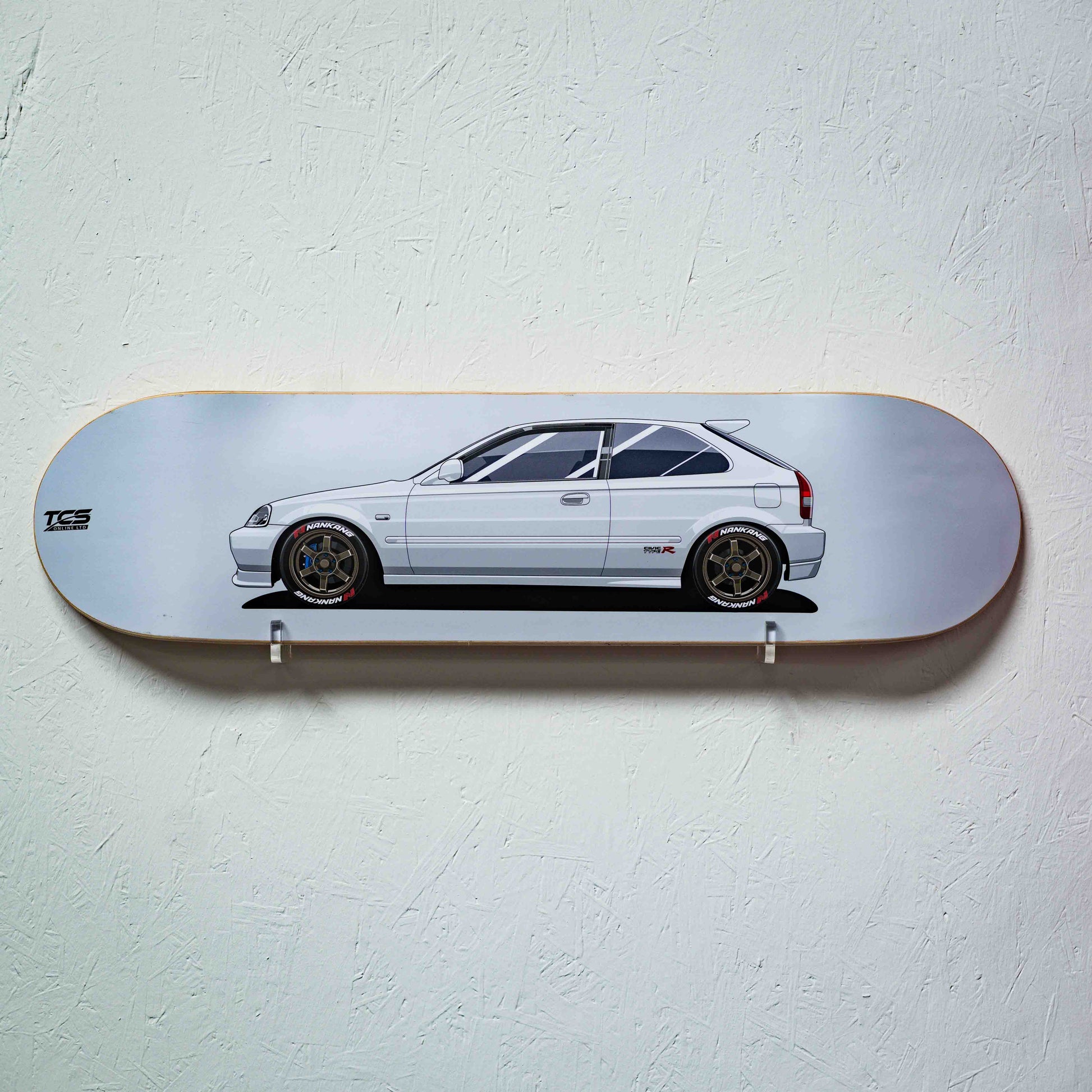 Skateboard deck with a car illustration on a light gray background