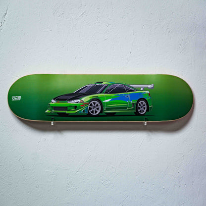 Skateboard deck with a green car design on a light gray background