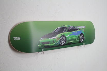 Skateboard deck with a green car design