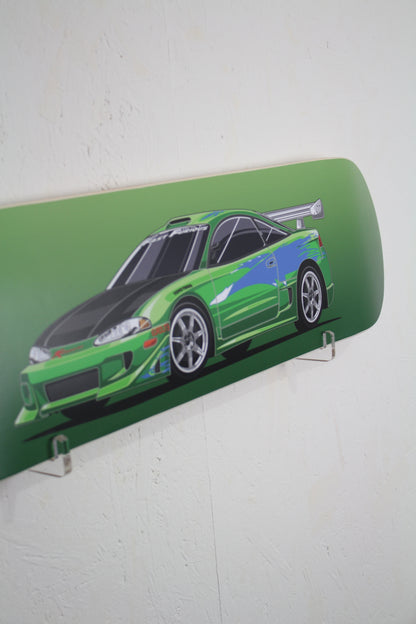 Skateboard deck with a green car design