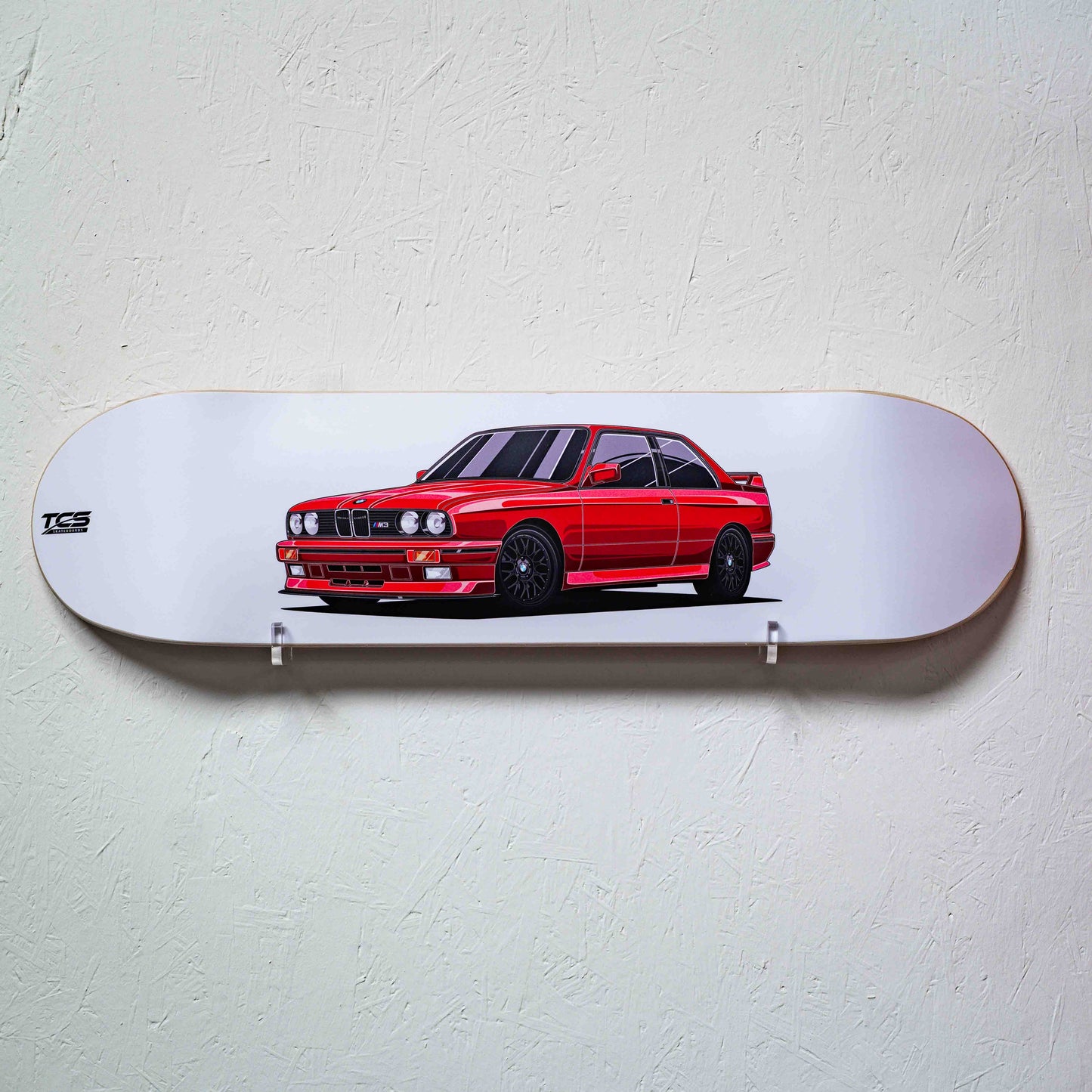 Skateboard deck with a red car illustration on a white background
