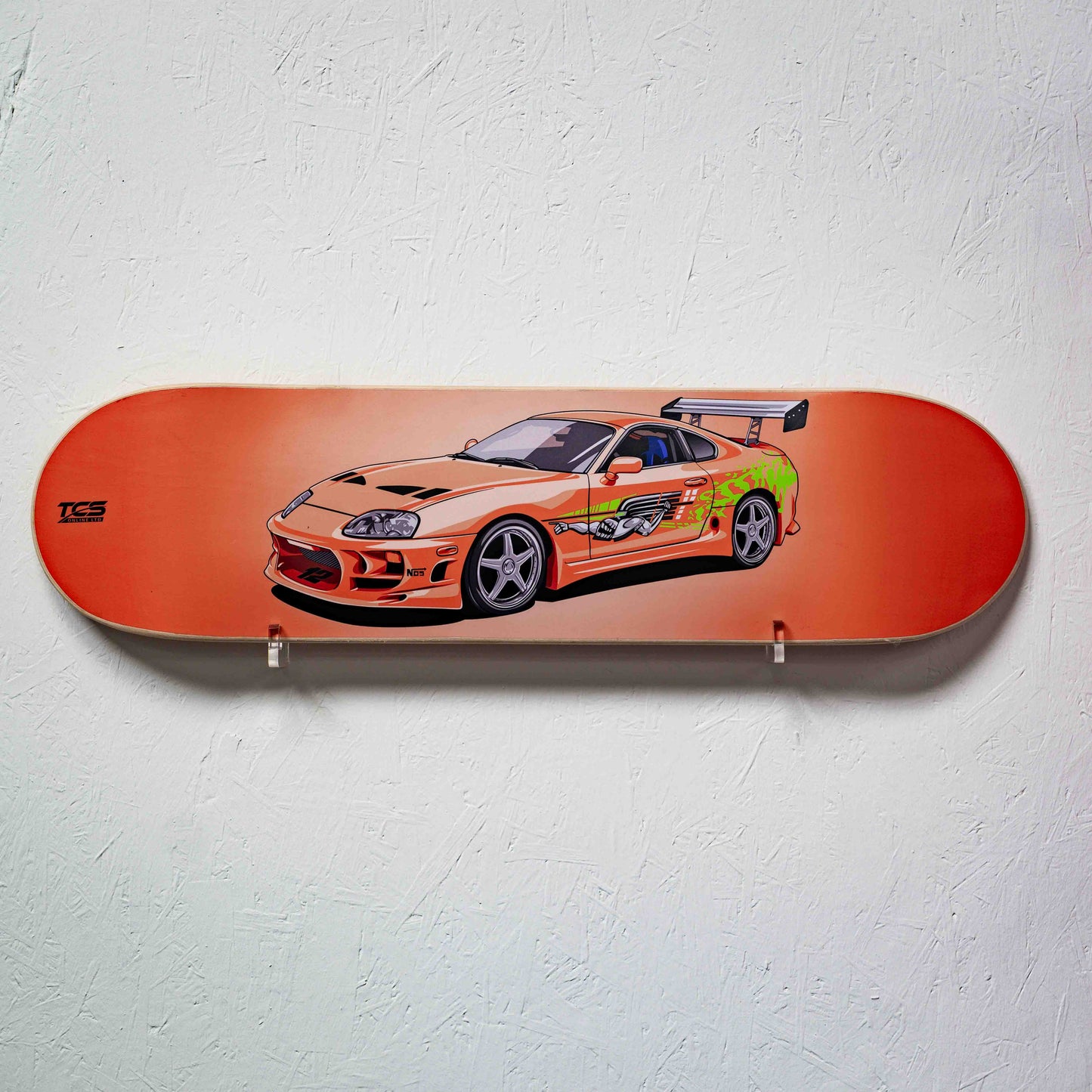 Skateboard deck with a car design on a white wall