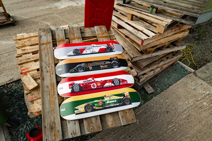 Skateboards with car designs on a wooden pallet